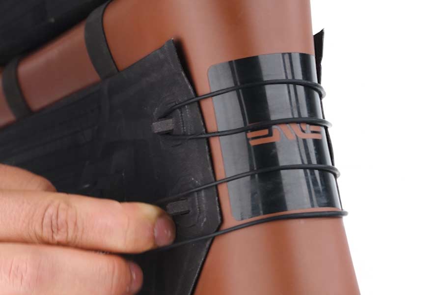 Down tube Velcro strap and head tube tension bands of the Apidura Aero Frame Module