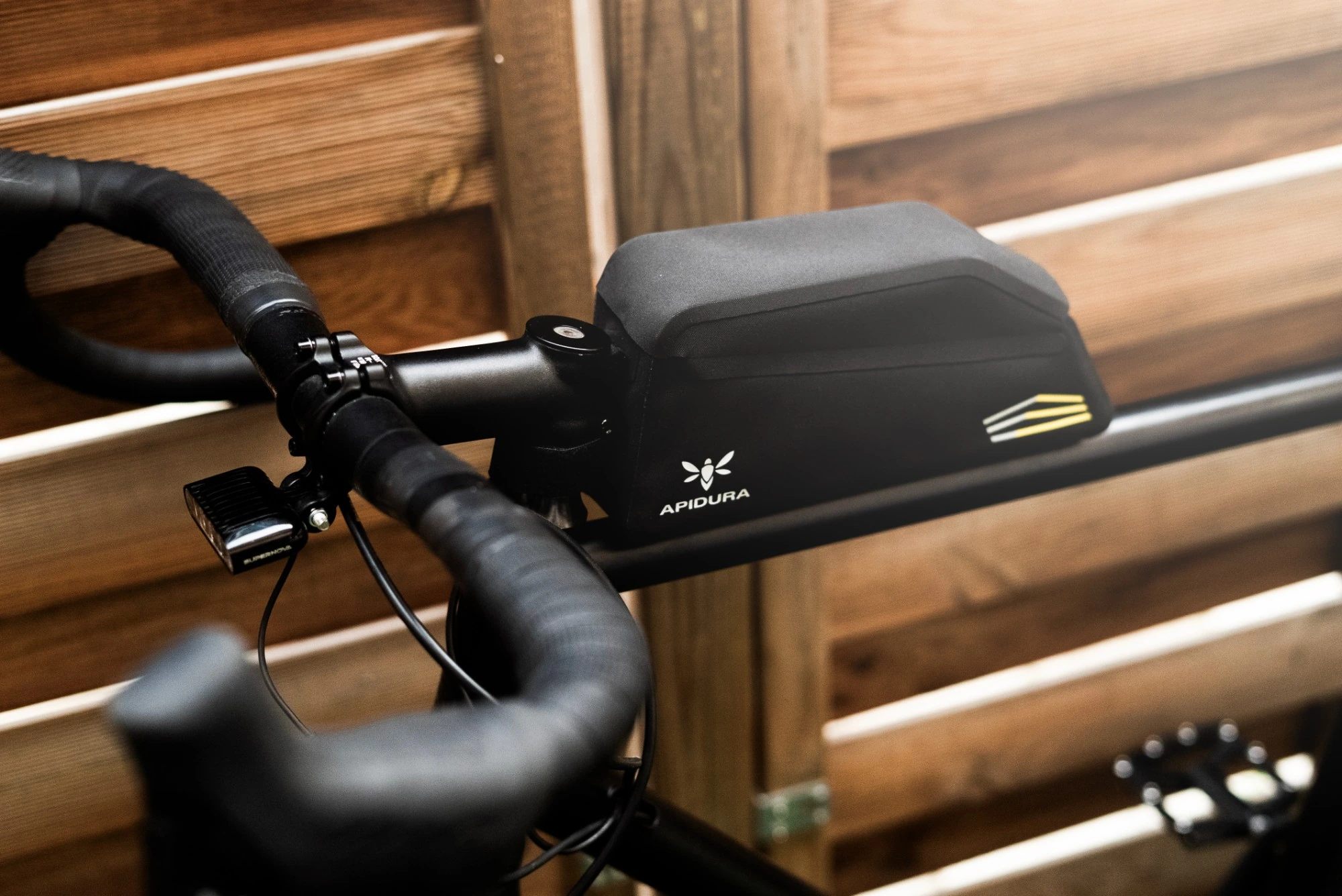 Apidura top tube bag on the Alpine 3x3 top tube next to the stem and the Hywave brake lever
