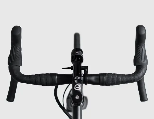 Gravel drop handlebar wrapped in bar tape, seen from the front