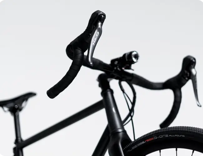 Close-up of the Booda Bike Atlas drop handlebar and brake lever with the saddle behind