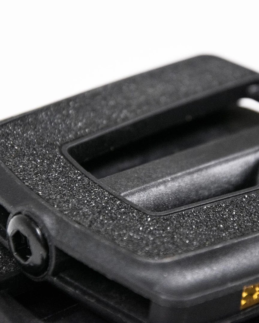 Close-up of the textured black top surface of the Booda Bike Flat Pedal Plastic with the plastic frame around it