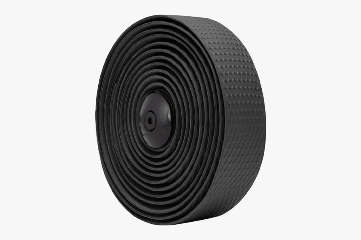 Roll of black textured Booda Bike Multibender handlebar tape with a black plug in the centre of the roll