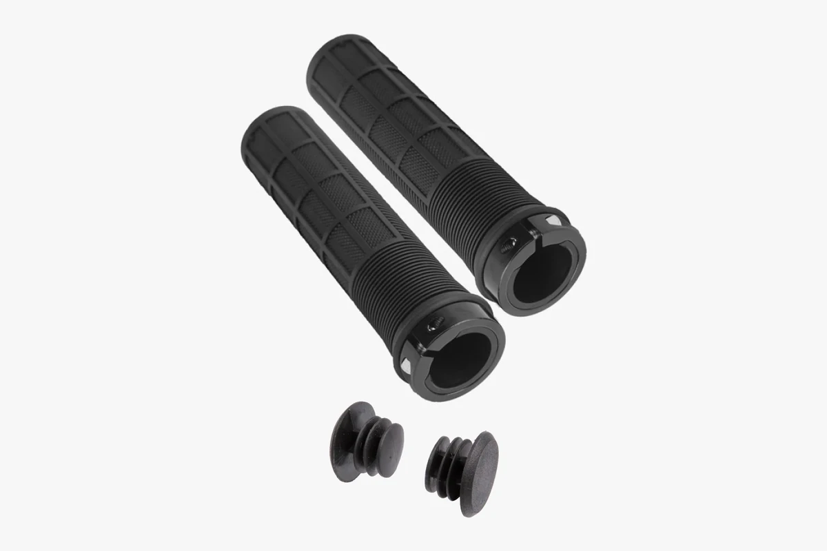 Pair of plain round black Booda Bike Non Ergo grips with a patterned surface and a black ring at one end, above two black bar end plugs