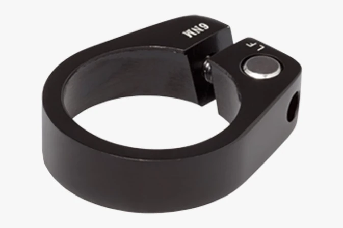 Black seatpost clamp with a clamping bolt and a 6 Nm marking on a light grey background