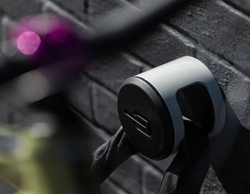 Mountain bike locked to a Hiplok ANKR wall anchor with a chain lock