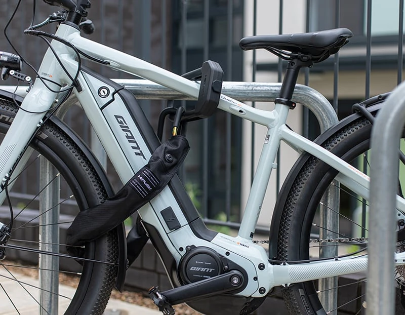 E-bike locked to a metal bike rack with the Hiplok E-DX D lock and loop-end chain
