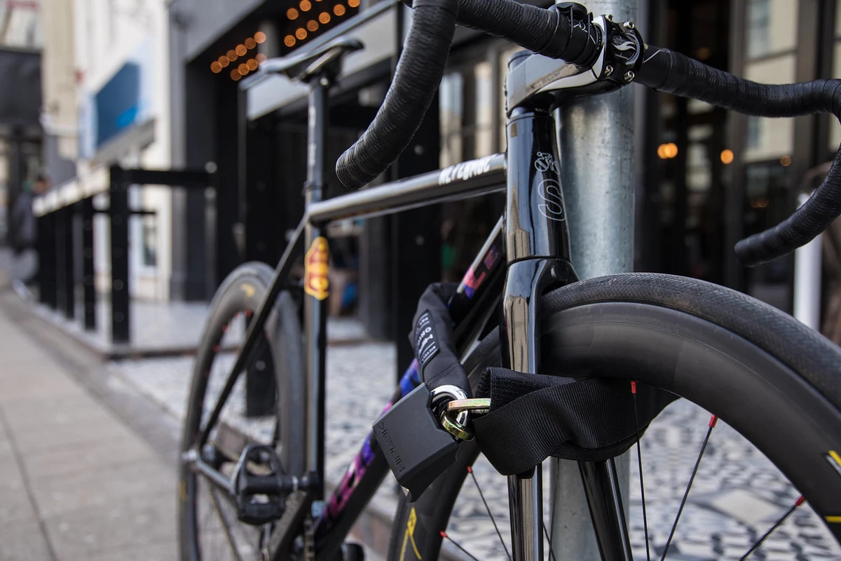 Bike locked to a post in the city with the Hiplok ORIGINAL chain lock