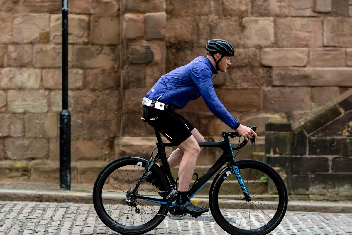 Cyclist riding with the Hiplok ORIGINAL chain lock worn round the waist