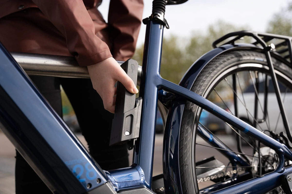 Removing the Hiplok SWITCH folding lock from its frame bracket on an e-bike