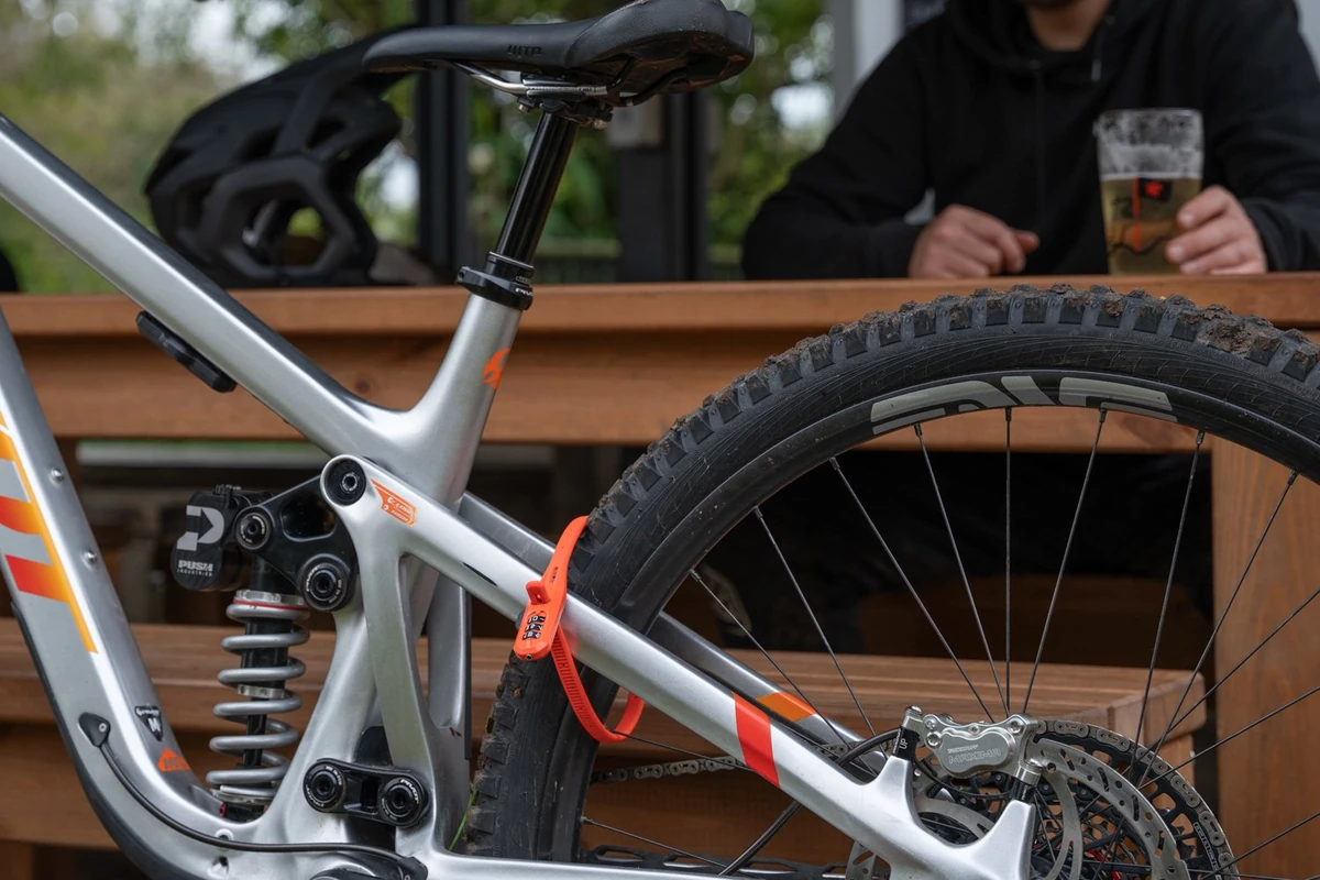 Hiplok Z LOK COMBO locking a bike wheel and frame at a café stop