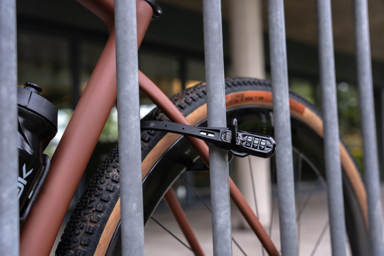 Black Hiplok Z LOK COMBO securing a gravel bike frame to a railing