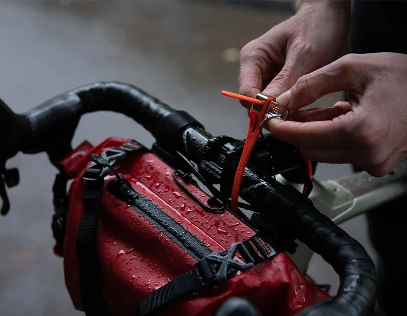 Hiplok Z LOK securing a saddle bag to bicycle handlebars
