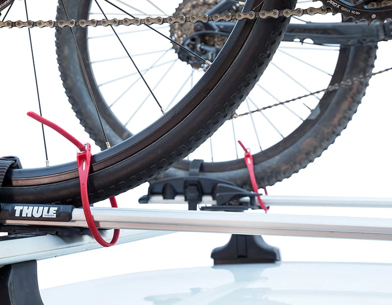 Two bicycles on a car roof rack secured with Hiplok Z LOK ties