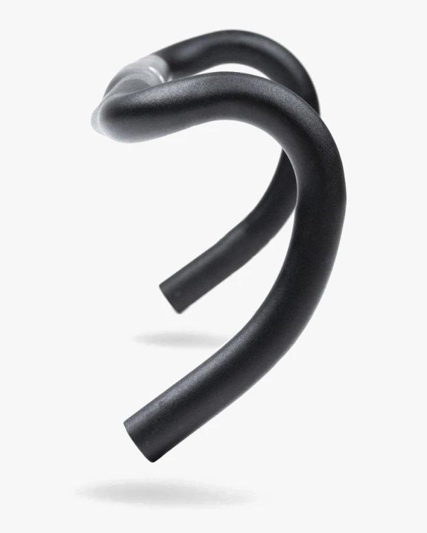 Three-quarter view of a black aluminium road handlebar showing the curve from the tops down into the drops