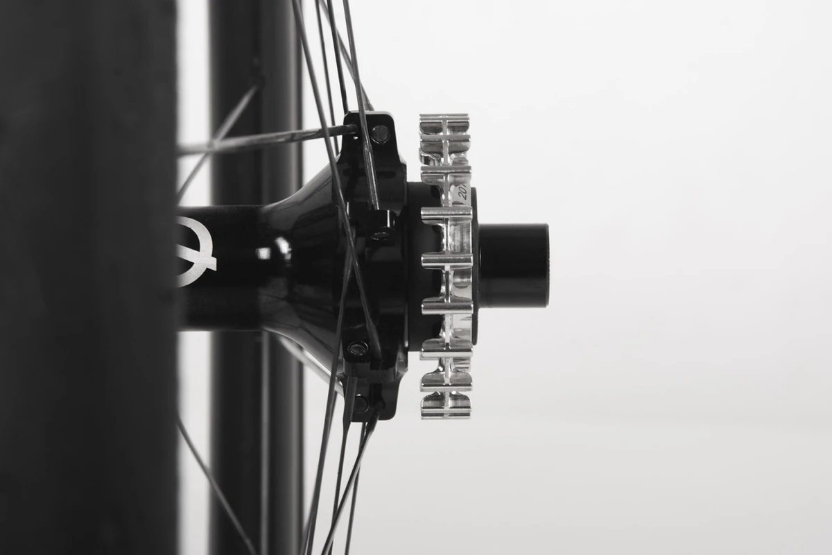Possible SpinnerOne rear hub laced into a wheel, shown with a sprocket for illustration