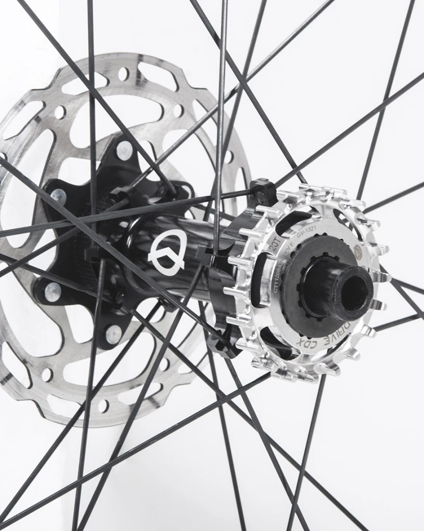 Possible SpinnerOne rear hub laced in the wheel, shown with a disc rotor and sprocket for illustration
