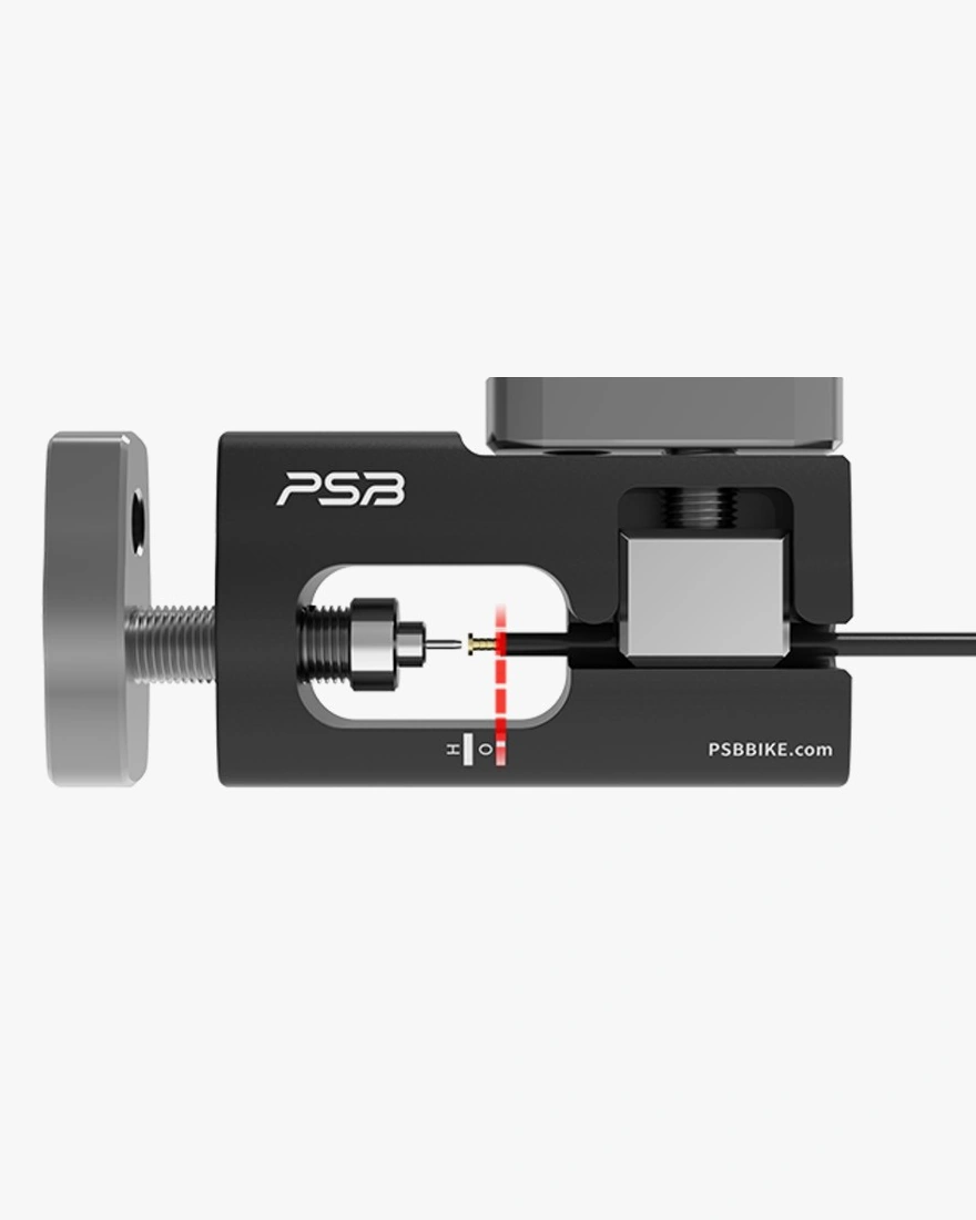 PSB Needle Driver Tool with a brake hose placed in the clamp and a red line marking the alignment of the hose