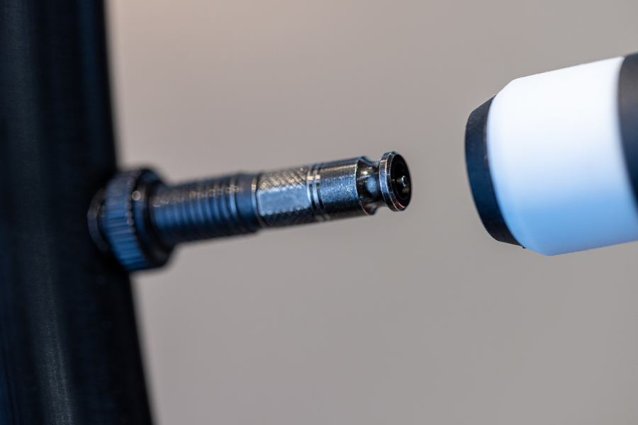 Schwalbe Clik Valve pump head adapter clicking onto a converted valve