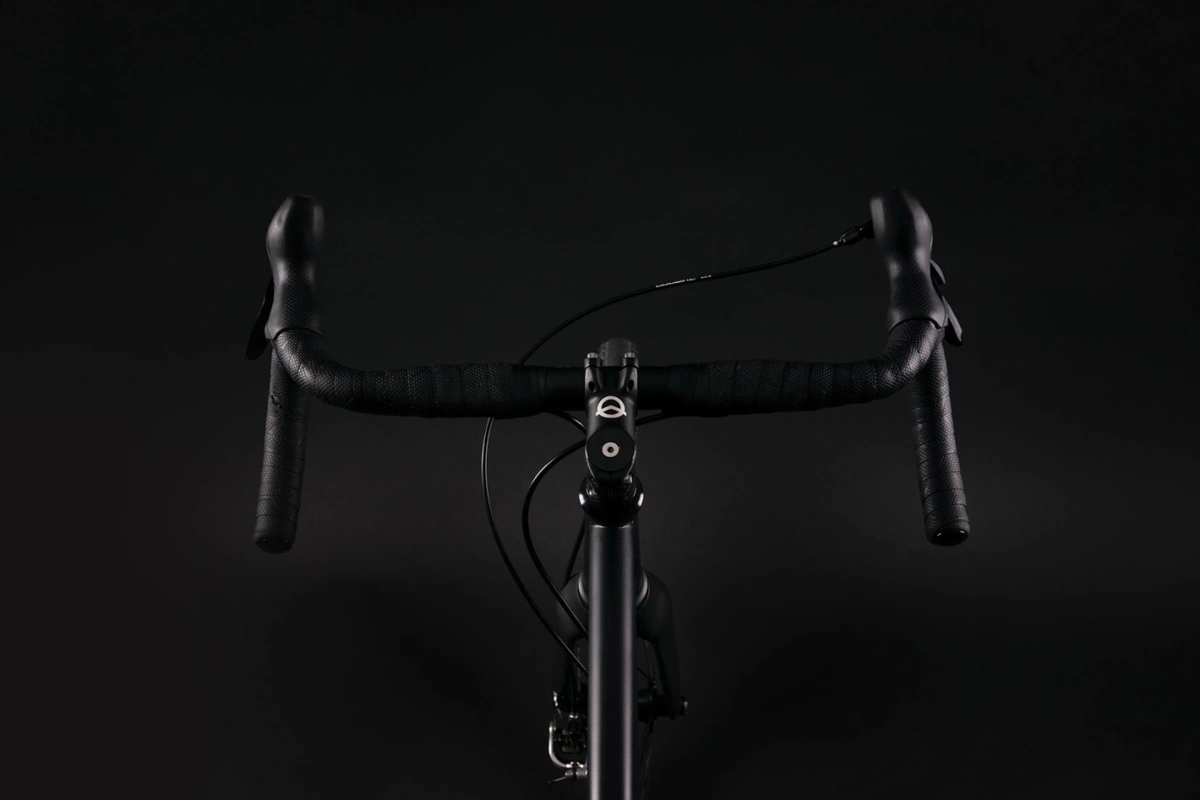 Front view of the Booda Bike Hiker cockpit: drop handlebar with two brake levers and a small black stem above the head tube