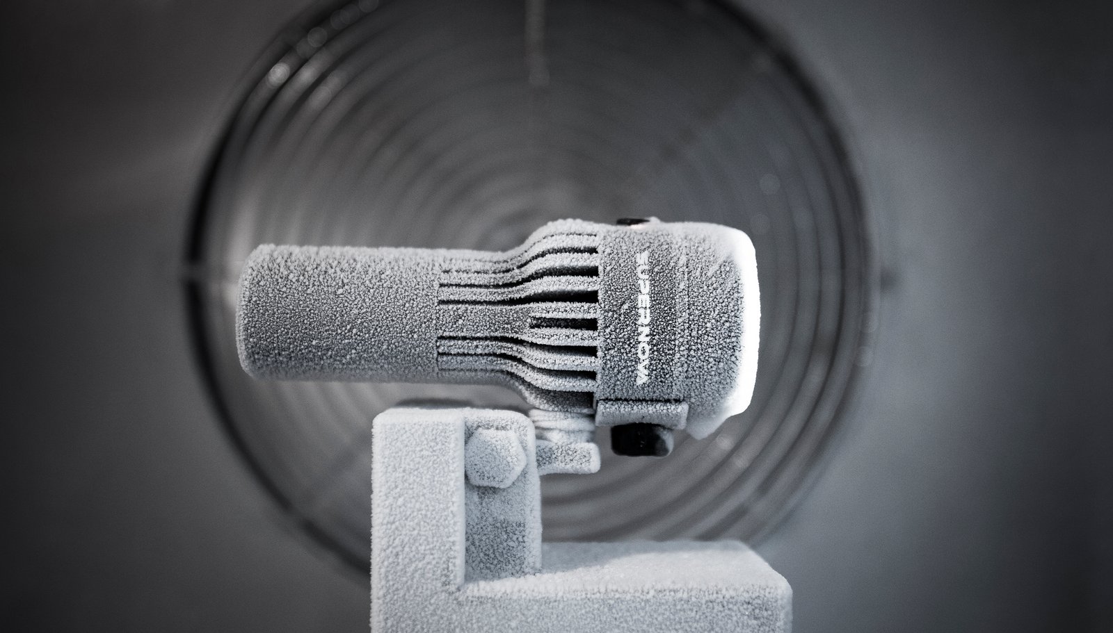 Supernova Airstream 2 covered in a layer of frost on a stand in front of a large fan